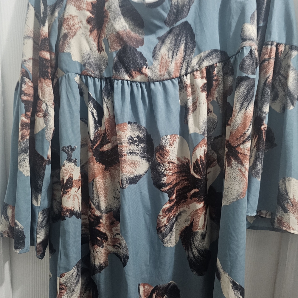 ￼

This is an Altar'd State Blue Floral Square Neck Tie Back Mini Dress - Picture 3 of 5